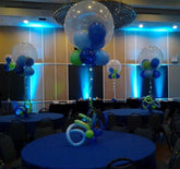 36 Inch clear hot air balloon centerpiece with curly Q balloons at the with colorful latex inside and on the bottom of the hot air balloon